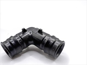Black PVC pipe fittings isolated on white background. Black plastic water pipe. PVC accessories for