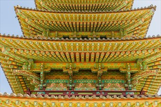 Buyeo, South Korea, July 7, 2018: Eves of colorful Buddhist five story pagoda at Neungsa Baekje
