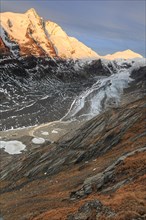 Glacier tongue in front of a mountain peak at sunrise, autumn, Pasterze and Grossglockner, Hohe