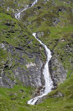 Waterfall on a green mountainside, Berliner Hoehenweg, Zillertal Alps, Tyrol, Austria, Europe