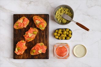 Top view of sandwiches with salmon and mashed avocado