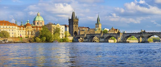Panorama of old town with Charles Bridge on Vltava river and Old Town Bridge Tower, famous tourist