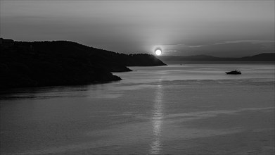 Sunrise in the Baia di Mola bay off Porto Azzurro, black and white photo, Elba, Tuscan Archipelago,
