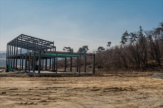 Chungju, South Korea, March 22, 2020: For editorial use only. Metal frame of industrial building at