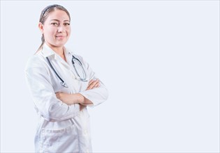 Portrait of smiling female doctor with crossed arms isolated. Successful female doctor with arms