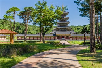 Buyeo, South Korea, July 7, 2018: Sidewalk leading to main gate of Neungsa Baekje Temple with five