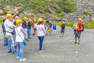 Tourist group on a guided tour of the former Miniere Calamita mine, Elba, Tuscan Archipelago,