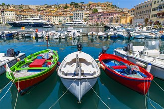 Fishing boats and luxury yachts in the harbour of Portoferraio, Elba, Tuscan Archipelago, Tuscany,