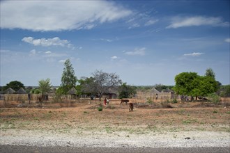 Small village settlement, village, african, village-like, blue sky, road, overview, near Guamare in