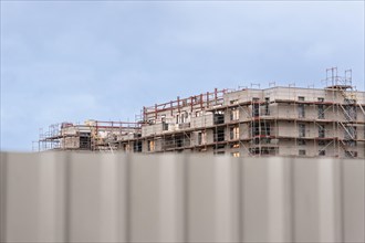 Scaffolding at the construction site of a new housing estate in Duesseldorf, Germany, Europe
