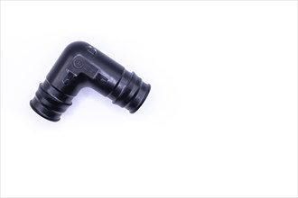 Plastic plumbing elbow. Elbow base Uponor plumbing tool