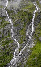 Mountain stream flowing down a steep rocky slope, waterfall, Berliner Hoehenweg, Zillertal, Tyrol,