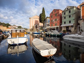 St. Anthony's Church in the morning light, boats in the harbour, Veli Losinj, Losinj Island,