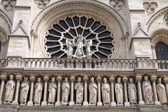 Figures of saints, detail on the Gothic entrance portal of Notre Dame de Paris Cathedral, Paris,