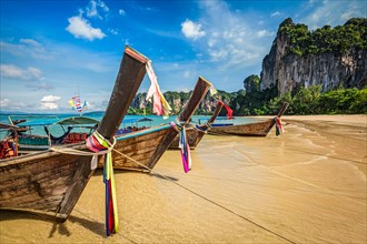 Long tail boats on tropical beach Railay beach in Thailand