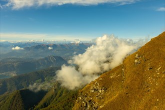 Aerial View over Beautiful Mountainscape with Clouds and Lake Lugano and City of Lugano in a Sunny