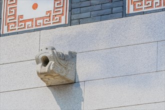 Seoul, South Korea, March 18, 2017:Concrete dragon figure mounted in the wall of Gyeong Bok Gung
