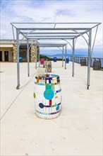 Wine barrels on the terrace of the Tenuta delle Ripalte winery, Elba, Tuscan Archipelago, Tuscany,