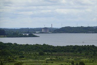 Former nuclear power plant Centrale nucleaire de Brennilis at the Reservoir de Saint-Michel, behind