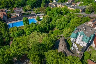 Bird's eye view of the swimming pool next to green trees and buildings, Rabeneck Youth Hostel,