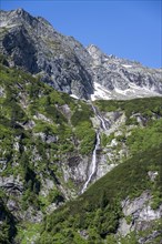 Kesselbach waterfall, rocky mountain peaks, Berliner Hoehenweg, Zillertal Alps, Tyrol, Austria,