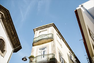 Interesting view of Porto architecture, looking up toward the blue sky, Portugal, Europe