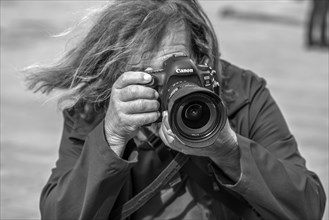 Photographer taking pictures in Piazza de Ferrari, Genoa, Italy, Europe