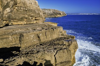 Beautiful cliffs and rock formations in Peniche, Portugal, on sunny day. Weathered rock formations,