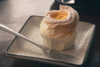 Close up of a brazo de mercedes cupcake, a popular authentic Filipino dessert. Dipolog,