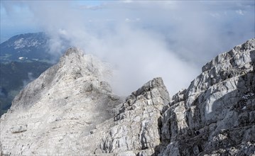 Rocky mountain ridge with clouds, Watzmann crossing, at the summit of the Watzmann Mittelspitze,