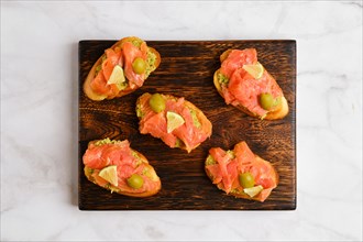 Top view of sandwiches with salted salmon and avocado