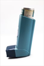 Asthmatic inhaler isolated. Medical asthma inhaler with cap on isolated background