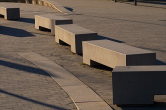 Concrete seats in a square without people