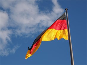 German flag over blue sky