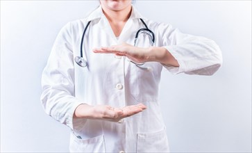 Female doctor hands presenting something isolated. Hands of female doctor holding something