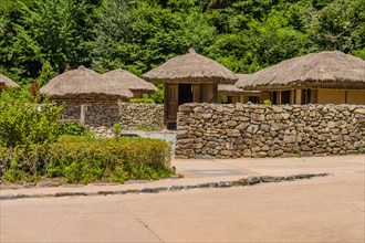 Buyeo, South Korea, July 7, 2018: Traditional Korean village with building built of wood and straw