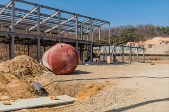 Chungju, South Korea, March 22, 2020: For editorial use only. Large round storage tank on ground in