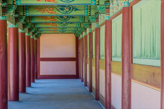 Buyeo, South Korea, July 7, 2018: Walkway under pavilion with details of colorful ceiling at
