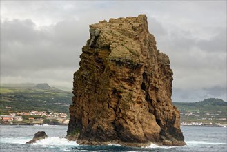Imposing rock monolith 'Iieu em Pe' stands in the Atlantic Ocean off the coast of the island of