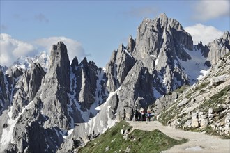 Hiker, mountain panorama facing south in Alta Pusteria, Sesto, Dolomites, South Tyrol, Italy,