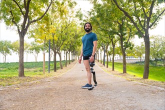 Portrait with wide view and copy space of a runner with a artificial leg standing outdoors