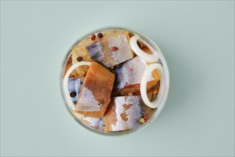 Top view of marinated mackerel in a glass jar