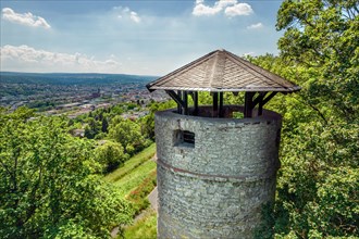Stone observation tower surrounded by trees with a view of a landscape, Wartbergturm, Pforzheim,