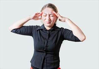 Young woman with headache isolated. Portrait of girl suffering from migraine on isolated background