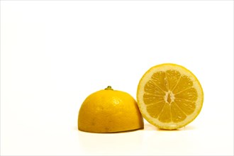 Close-up of a fresh lemon cut in half isolated on white background and copy space