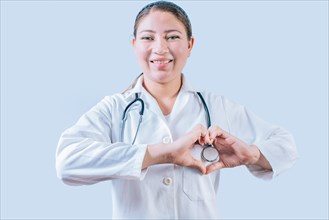 Smiling doctor making heart shape on isolated background. Friendly female doctor making heart