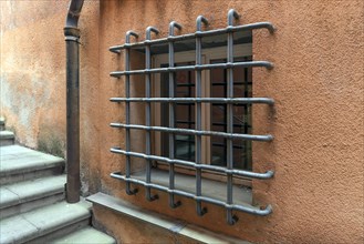 Heavily barred window on a residential building, Genoa, Italy, Europe