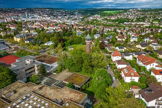 Aerial view of a city with a water tower surrounded by trees and residential areas, Pforzheim,
