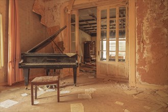 An old piano in a dilapidated room conveys a quiet melancholy, Urologist's villa Dr Anna L., Lost