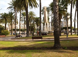 Fountain and palm trees in Plaza de Espana, Melilla autonomous city state Spanish territory in